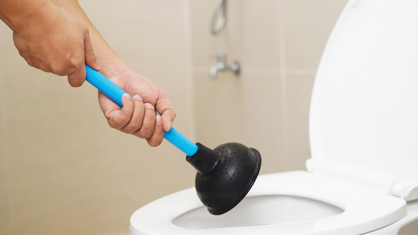 A Tubero Experts professional meticulously working on a complex plumbing system, ensuring quality service.