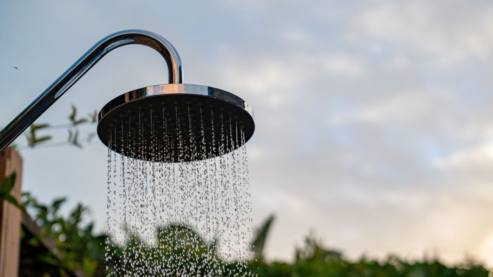 A steady drip of water from a kitchen faucet, highlighting a common household plumbing nuisance.

