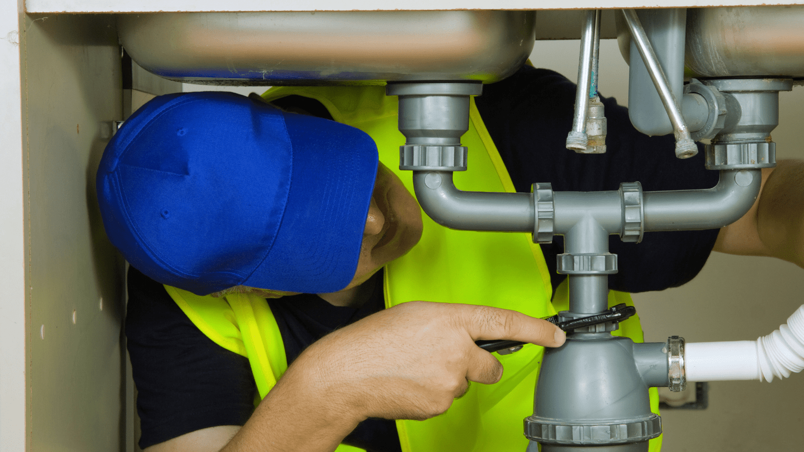 A Tubero Experts professional performing routine maintenance on a plumbing system, preventing future problems.

