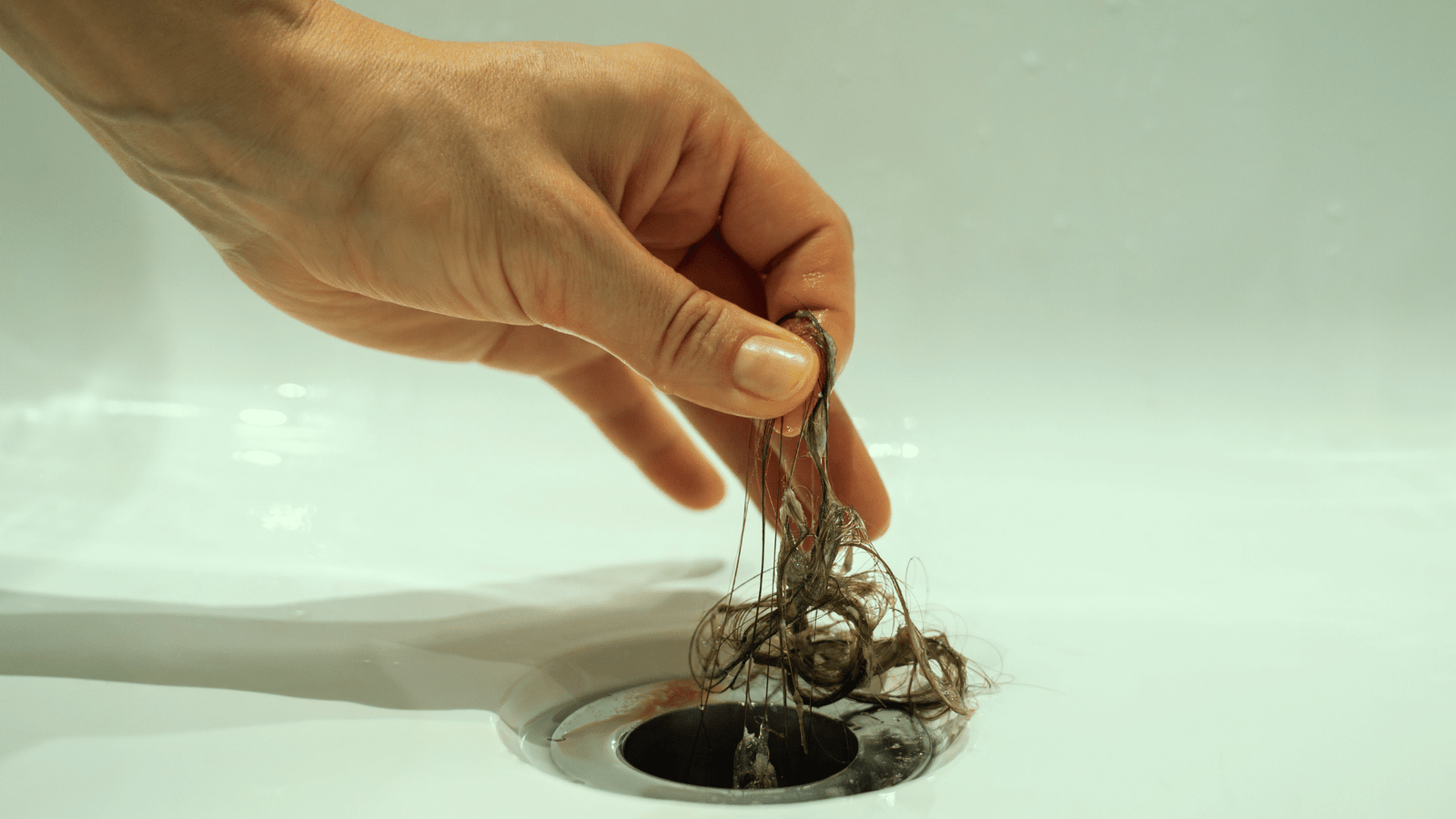 Stressed homeowner dealing with a plumbing issue.