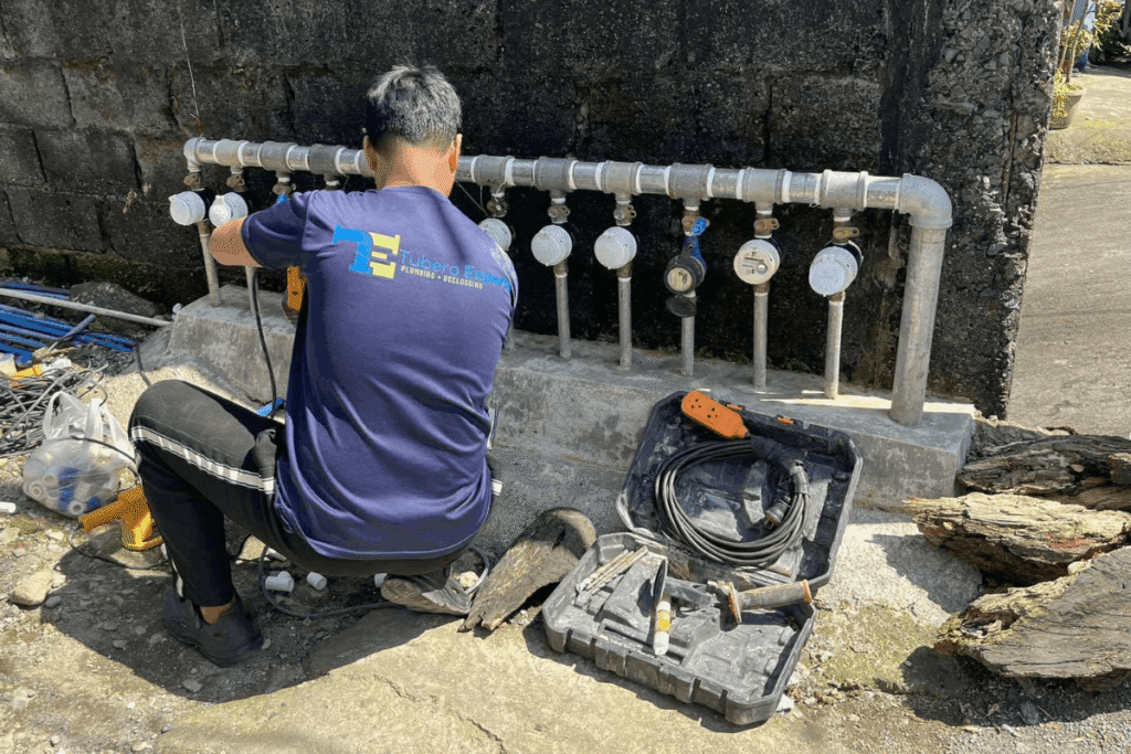 Tubero Experts plumber repairing a water meter in BGC.