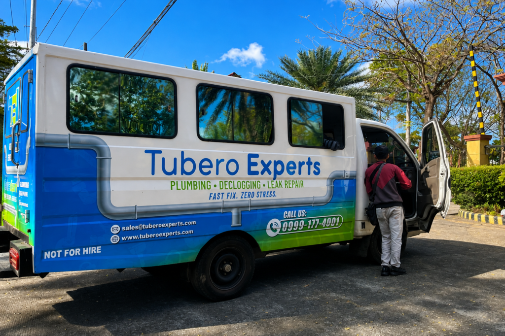 Tubero Experts service vehicle parked on-site, ready for a plumbing and water line repiping job.