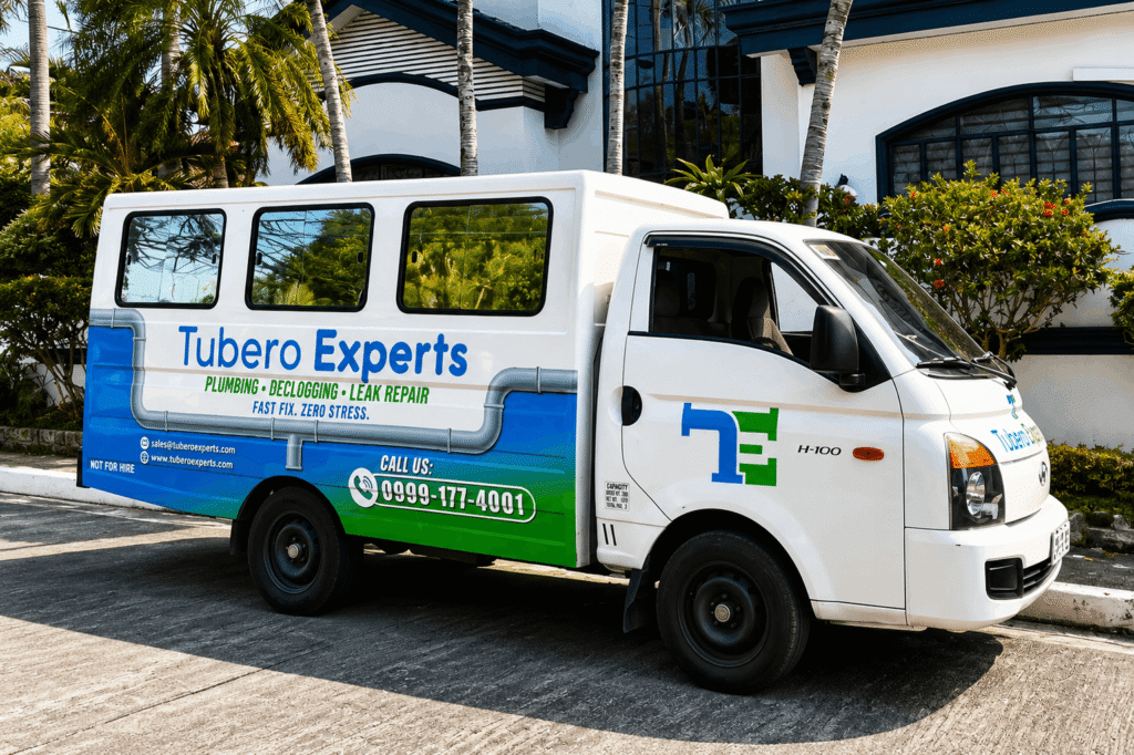 Tubero Experts branded service truck parked outside a residence