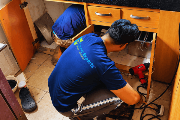 Under-sink repairs done neatly, with the cabinet left as clean as we found it.