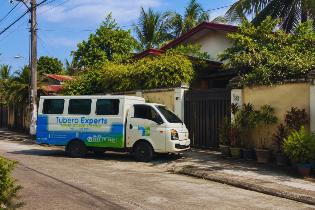 Tubero Experts service van parked outside a home