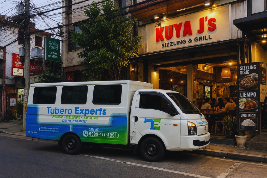 Tubero Experts service van parked outside a busy restaurant