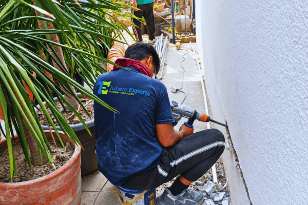 Sometimes a pipe has to be reached through the wall. We open it up carefully, do the repair or reroute, and keep the work as tidy as possible.
